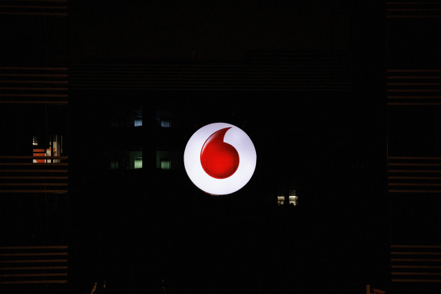 Archivo - Logo de la empresa de Vodafone encendido, a 10 de agosto de 2022, en Madrid (España)