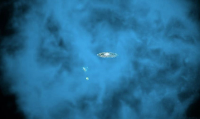 Representación artística de nuestra Vía Láctea y sus pequeñas galaxias compañeras rodeadas por un halo gigante de gas a millones de grados.
