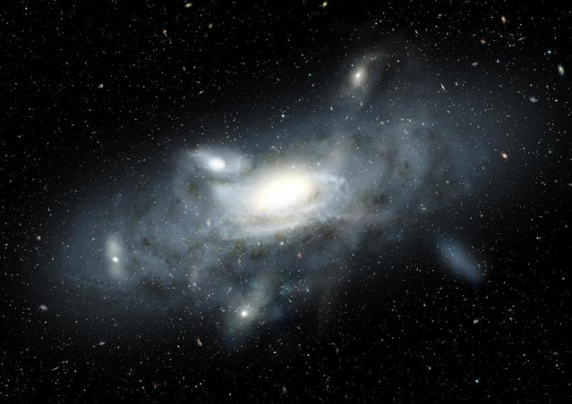 Esta imagen muestra una impresión artística de nuestra Vía Láctea en su juventud. Cinco pequeñas galaxias satélite, de diversos tipos y tamaños, están en proceso de acreción a la Vía Láctea.