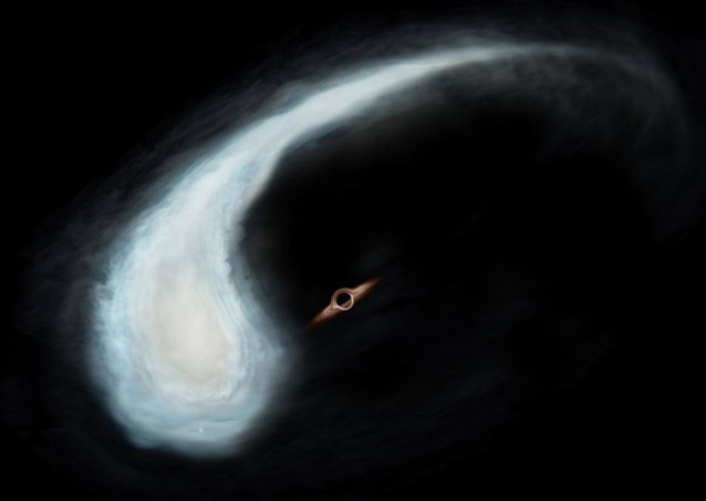 Impresión artística de la nube molecular 'Renacuajo' y el agujero negro en el centro gravitatorio de su órbita.