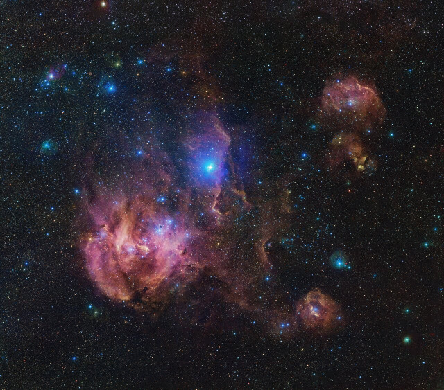 The Running Chicken Nebula comprises several clouds, all of which we can see in this vast image from the VLT Survey Telescope (VST), hosted at ESO’s Paranal site.