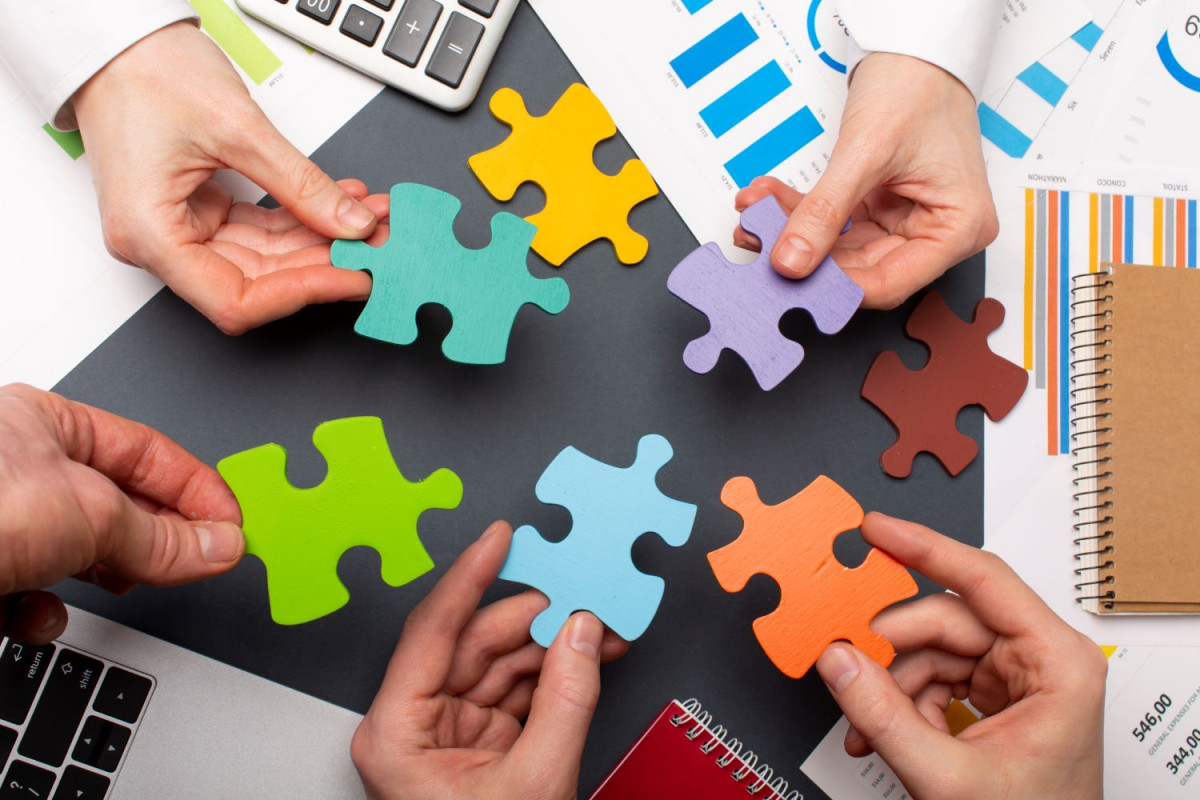 1 still life business roles with various puzzle pieces
