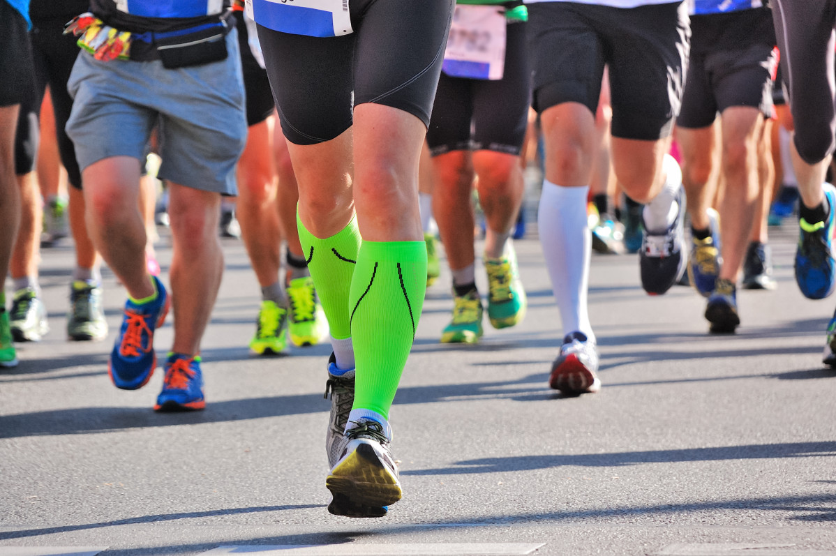 Marathon running race runners feet road sport fitness healthy lifestyle concept