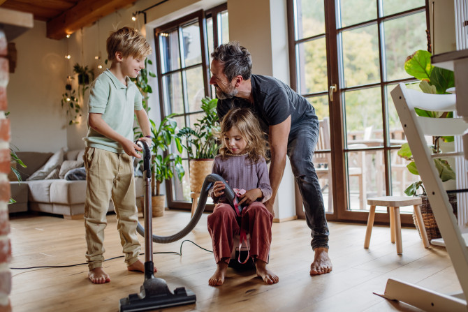 Father and kids cleaning house vacuuming the floo 2024 10 18 10 07 20 utc